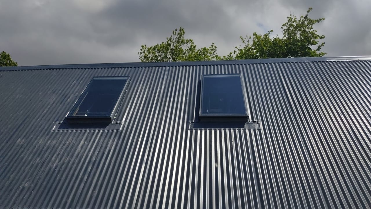Rooftop installation on a metal roof — site work under open skies