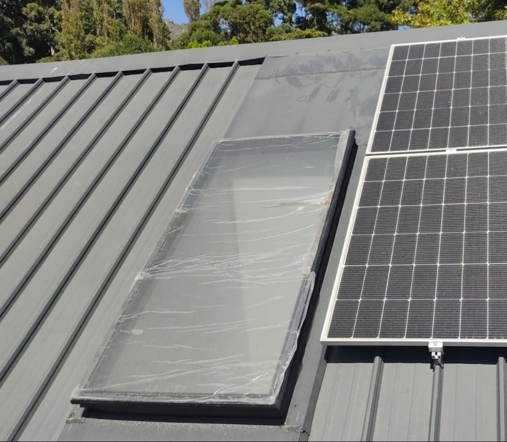 Skylight installed on a Concealed-Fix roof alongside solar panels — clean modern rooftop