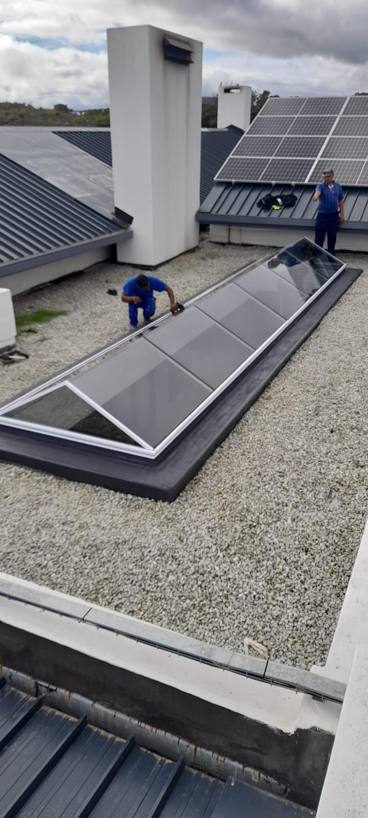 RWI Skylights team on site — rooftop installation in progress